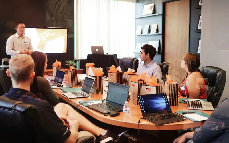 Consulting team reviewing a presentation around a conference table